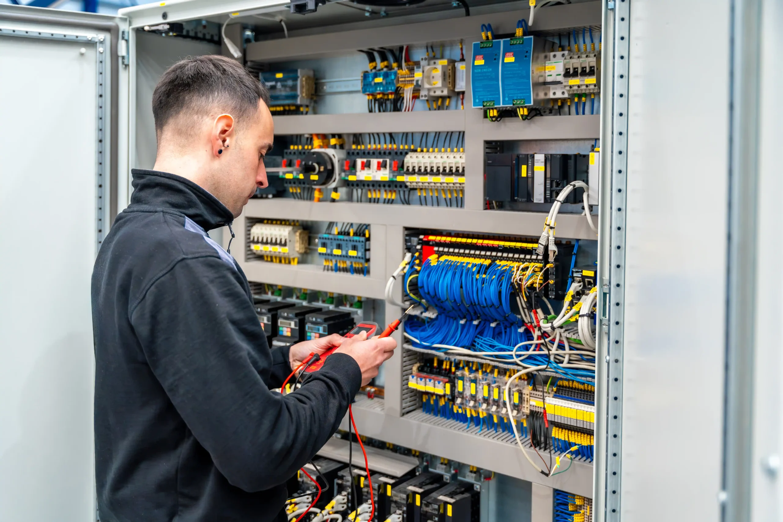worker-repairing-an-electrical-mechanical-system-i-2024-12-10-01-21-20-utc